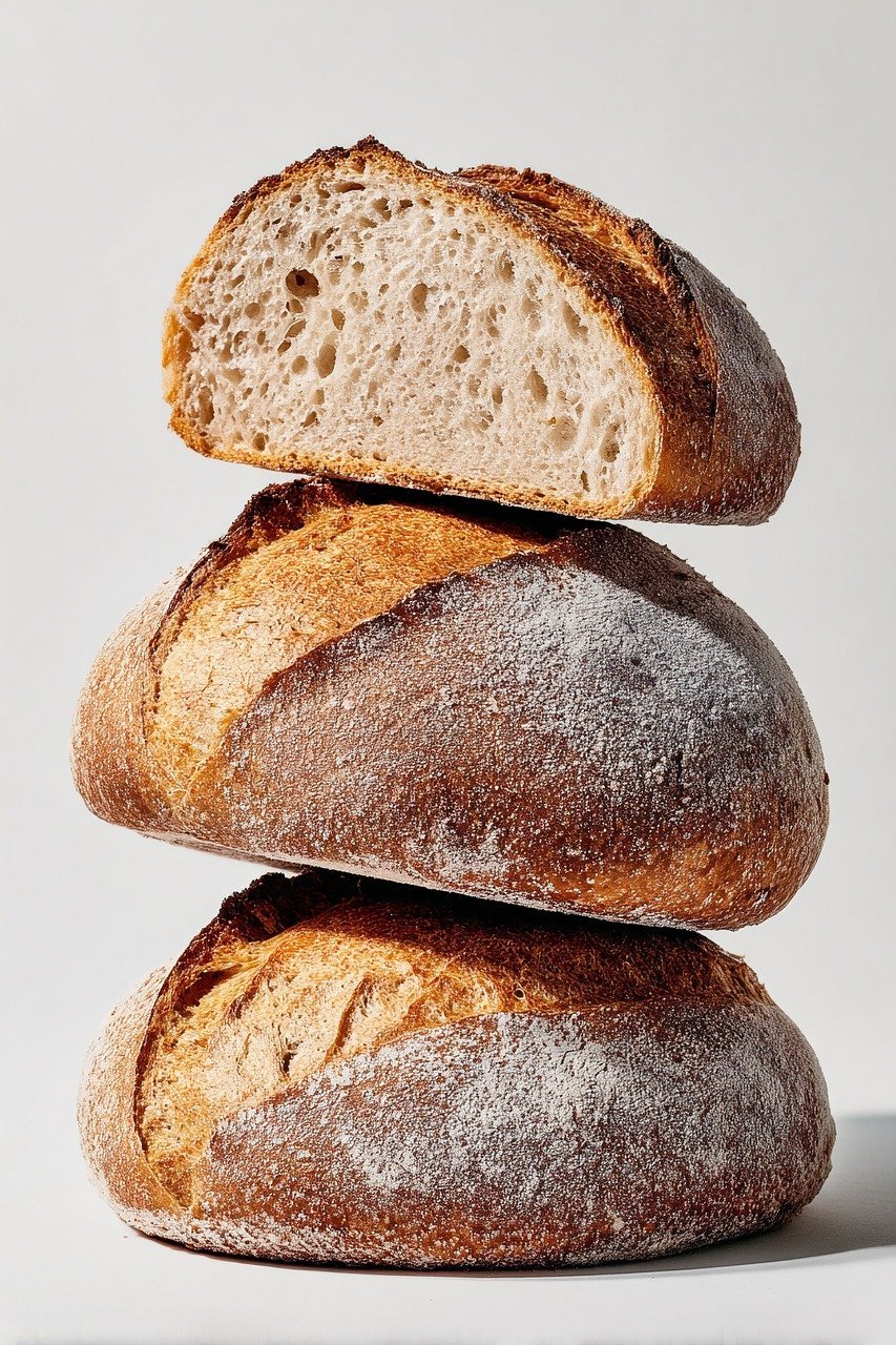 Close-up image of a nut and sesame seed protein bar on parchment paper, ideal for healthy snacking.