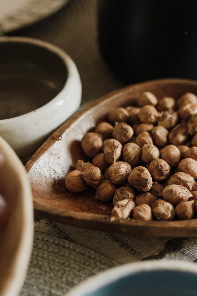 Close-up image of a nut and sesame seed protein bar on parchment paper, ideal for healthy snacking.